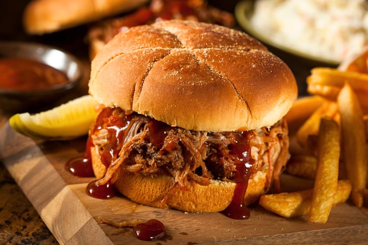 Pulled pork roll with fries on the side 