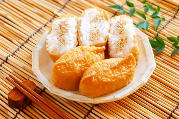 Inari sushi with sesame seeds on a plate