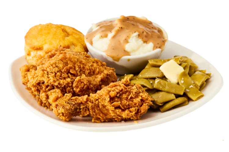 Fried chicken dinner with a side of mash, greens and a biscuit from Jack's Family Restaurant