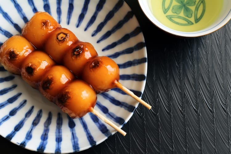 Rice balls with syrup on a stick