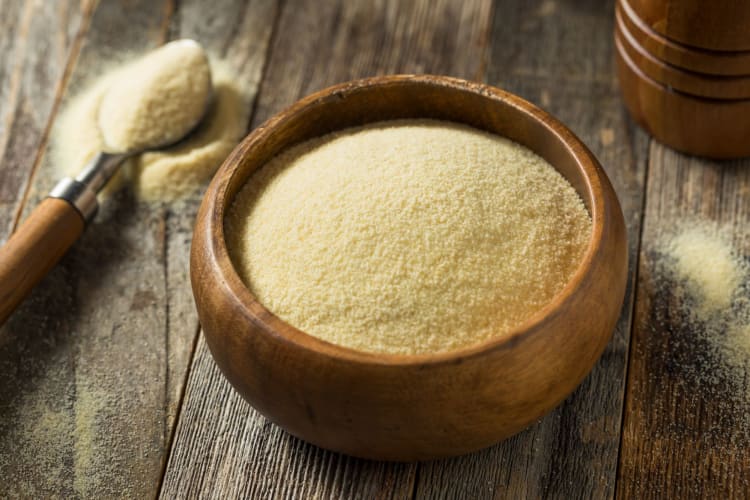 Semolina Flour in a bowl on a wooden table