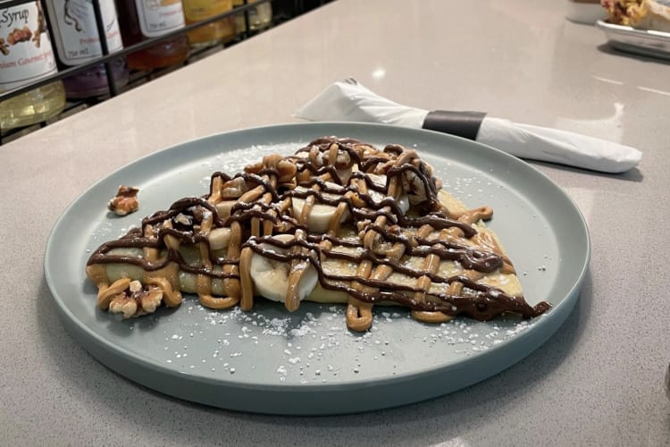 crepe with chocolate sauce on top