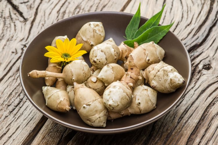 Sunchokes on a wooden table