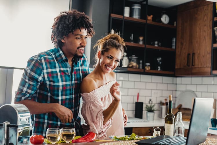 couple taking an online cooking class