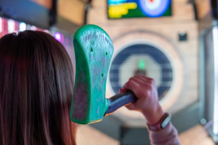 woman axe throwing