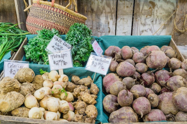 sunchokes and other root veg at a market