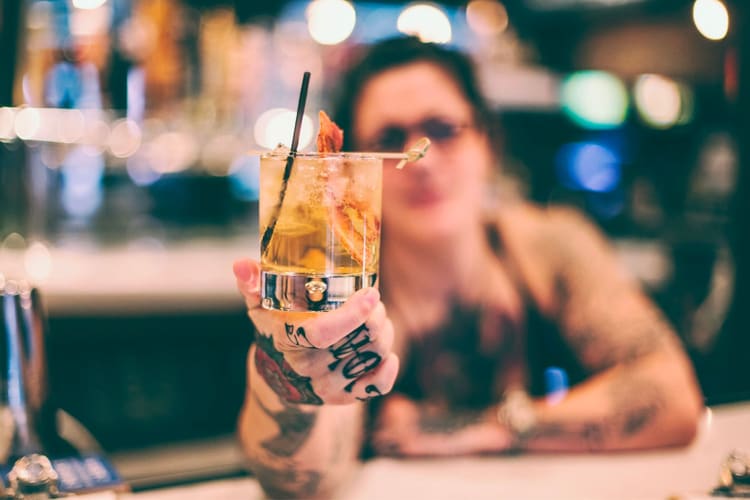 bartender holding cocktail