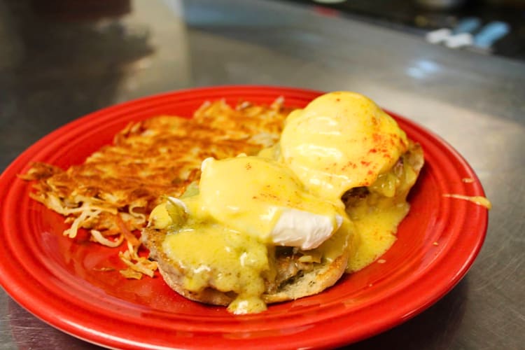 Eggs Benedict meal with hash browns from Jimmy’s Café