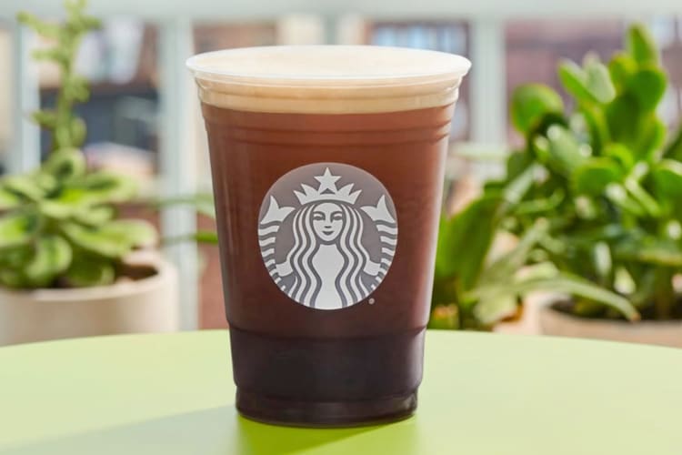 A starbucks nitro cold brew drink with foam