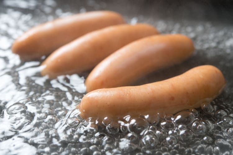 Sausages being boiled.