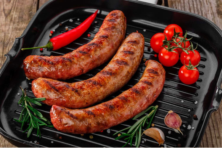 Sausages in a griddle.