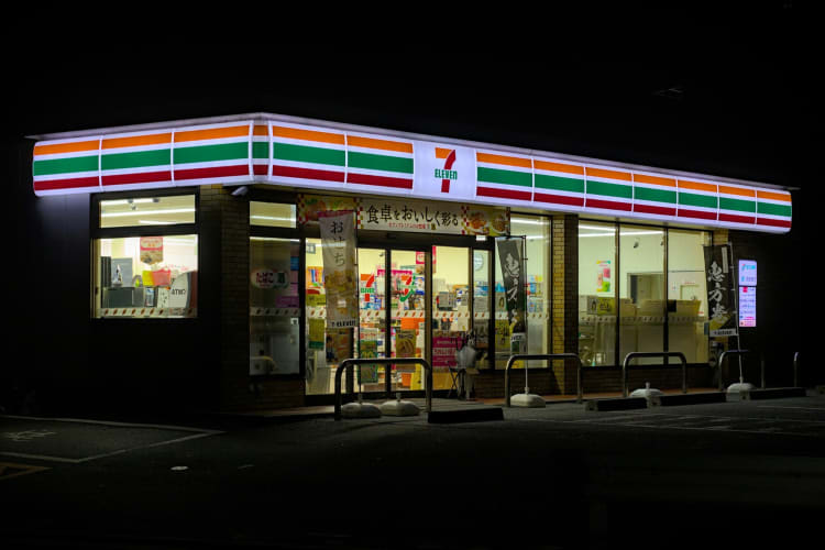 A 7-Eleven store lit up at night