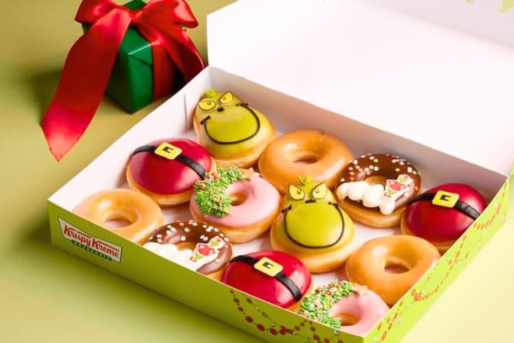 A green box with 12 holiday donuts