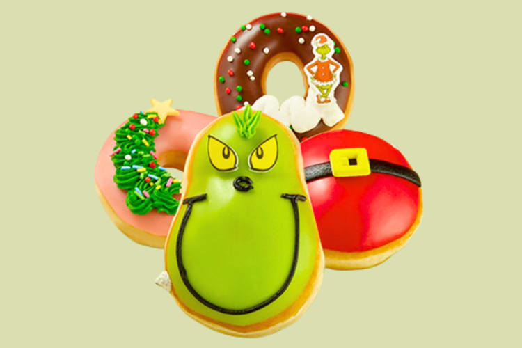 Four Grinch-themed Christmas donuts