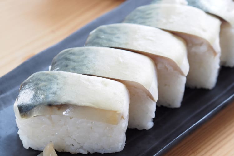 Pressed sushi topped with mackerel