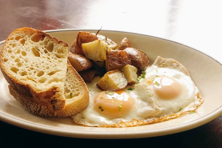 A meal with eggs, potatoes and toast, from LES Enfants de Bohème