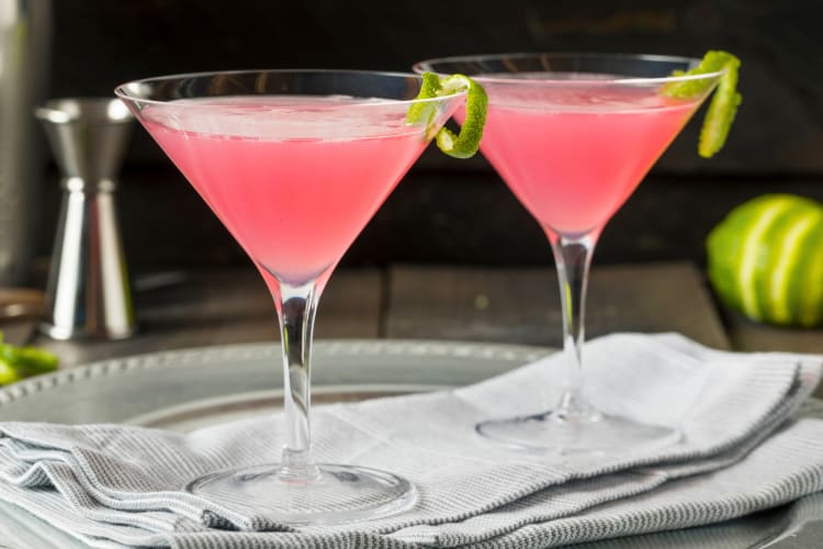 Two pink cocktails in martini glasses