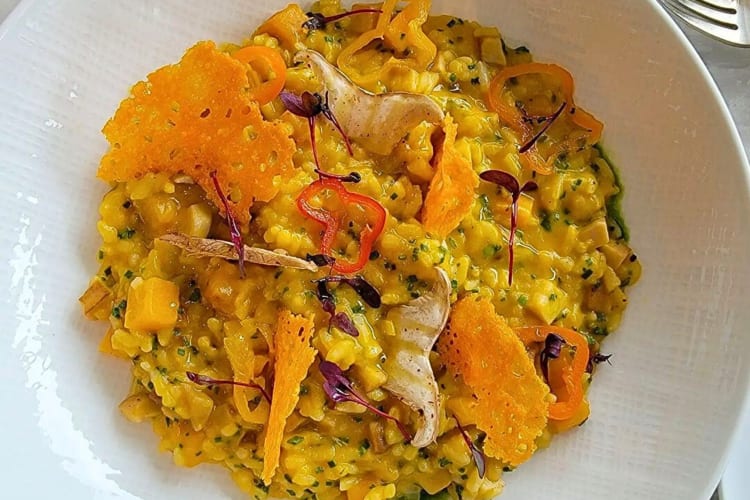 Aerial shot of golden rice risotto with pumpkin squash from Le Jardinier