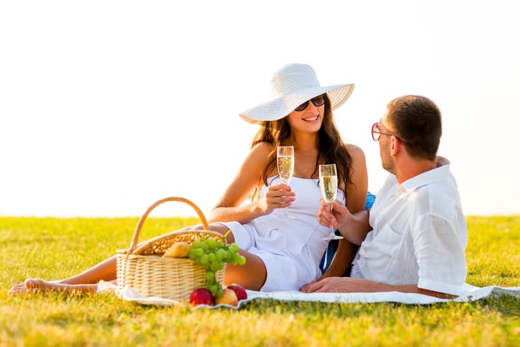 A couple having a picnic on the grass
