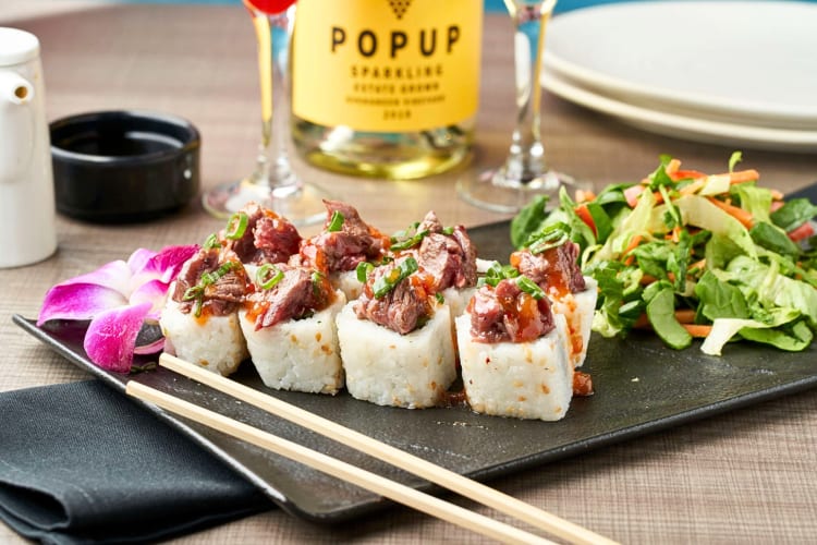 Sushi with a side salad from Ling & Louie’s Asian Bar and Grill