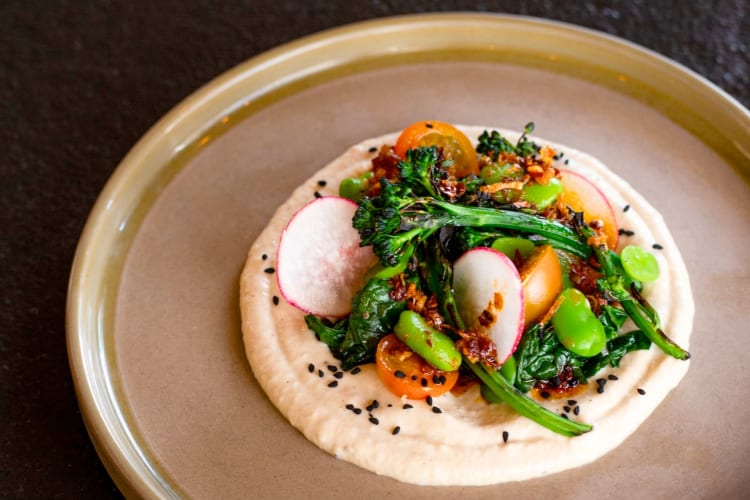 A purée with vegetables on a plate