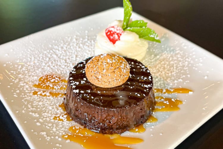 A chocolate dessert with cream