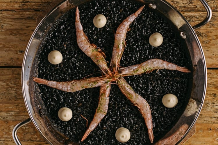 Aerial shot of a squid and rice dish from Llamber