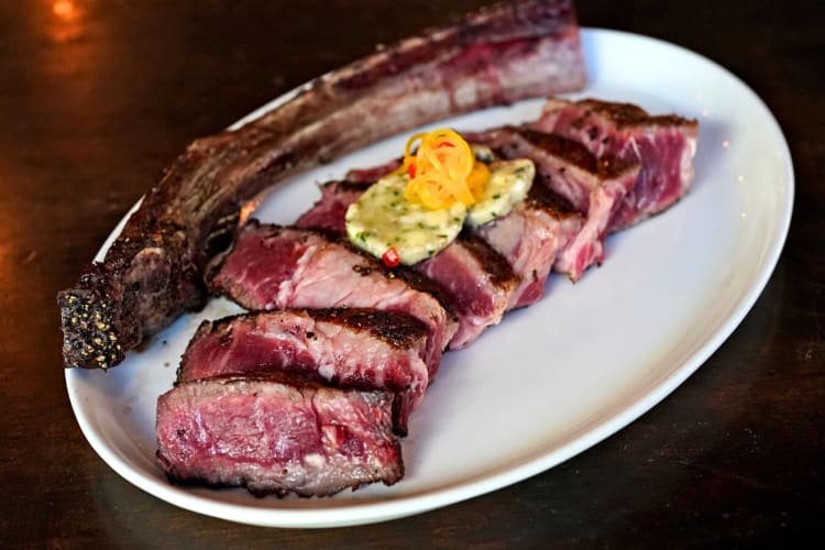 A large bone behind slices of meat from Lonesome Dove