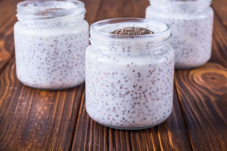 Three pots of chia seeds pudding.