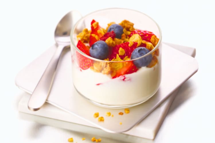 A berry parfait in a glass jar