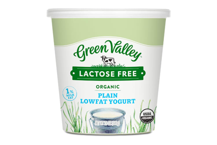 A green and white container of lactose-free yogurt
