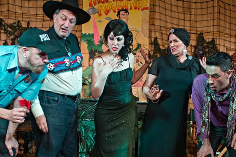 People in costume, acting in a dinner mystery show