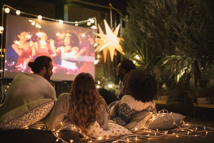 People watching an outdoor movie