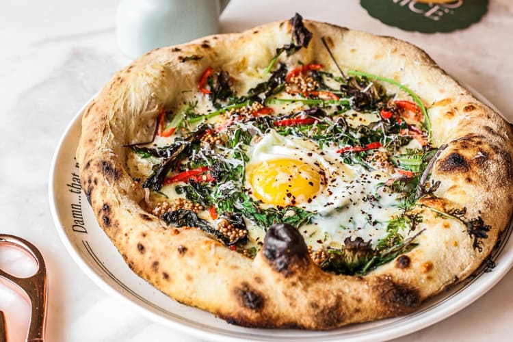 Pizza topped with an egg, from Mad Nice