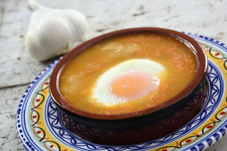 Sopa de ajo, or garlic soup, is a Madrid Food well worth adding to your list of must-tries.