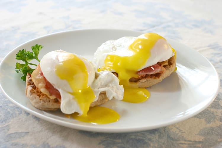 Eggs Benedict on a white plate