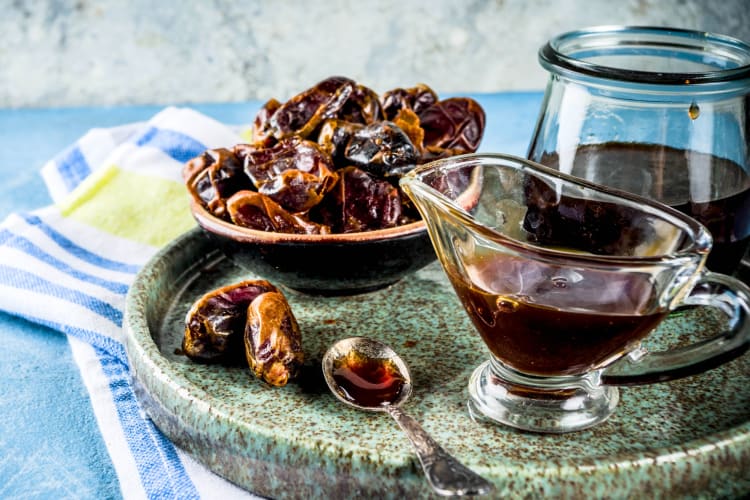 Dates and date syrup on a board