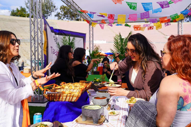 People eating and chatting at Masters of Taste, a food festival in Los Angeles
