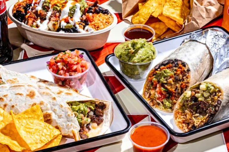 Tacos and burritos on a table