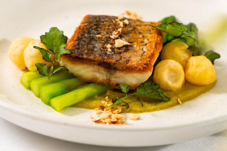 A fish, green vegetable and potato dish