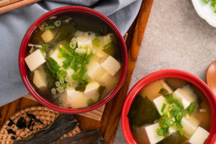 Bowls of miso soup with tofu and green onions