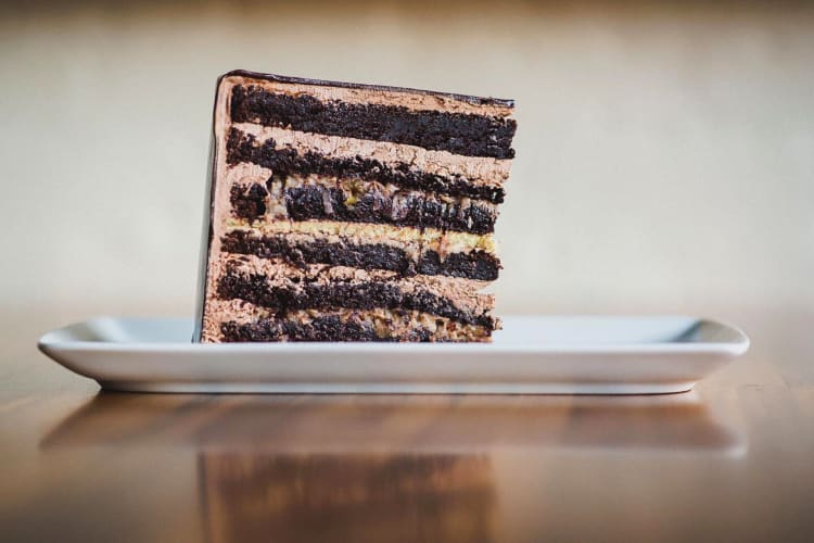 Side shot of a slice of chocolate cake from Moody Tongue in Chicago