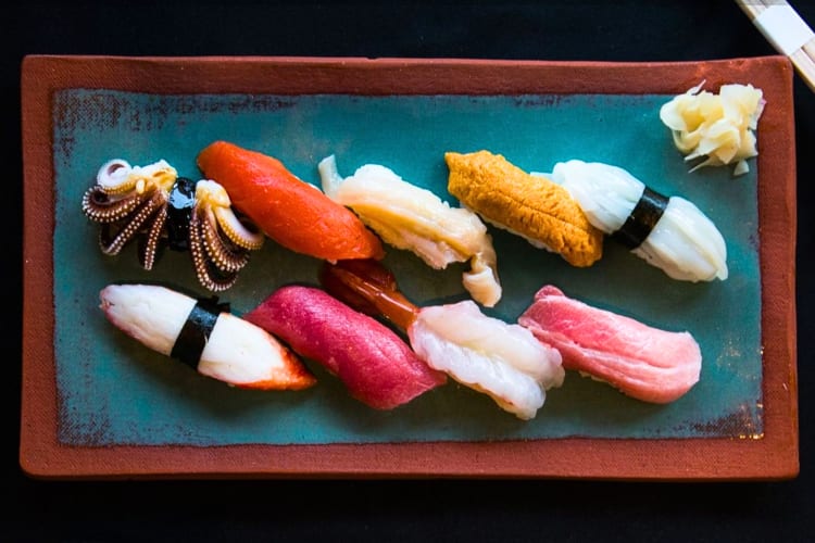 A selection of nigiri on a rectangular plate 