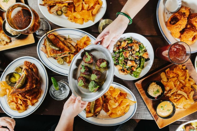 A table full of amazing food at one of the most expensive restaurants in Houston.