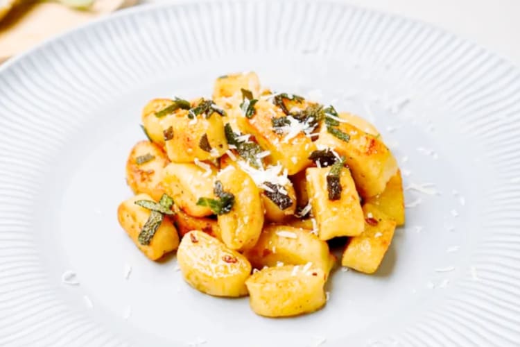A plate of gnocchi with sage
