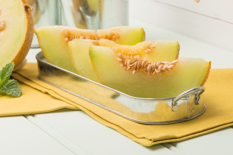 Cut honeydew muskmelon on a platter