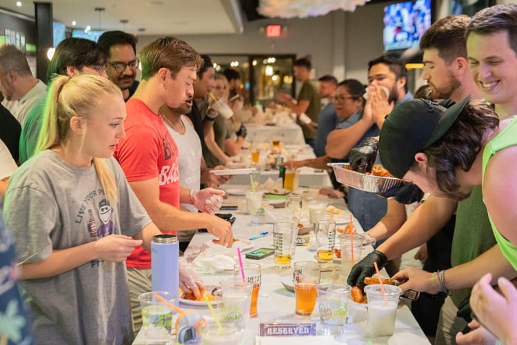 People doing food and drink tastings at Mutation Brewing Company, an event space in Atlanta