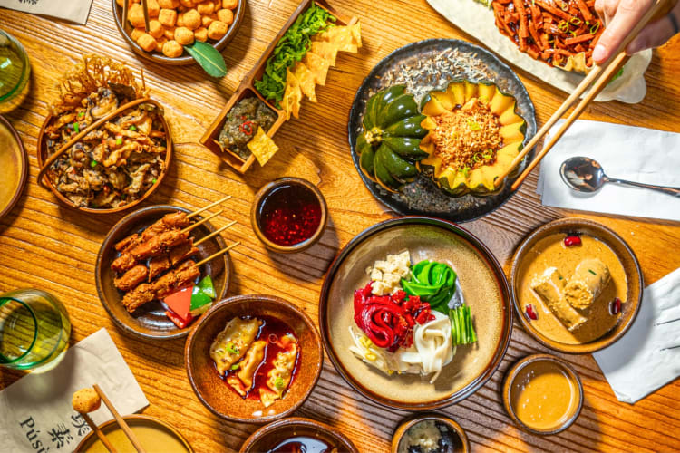 An aerial view of various Asian-style dishes on a table