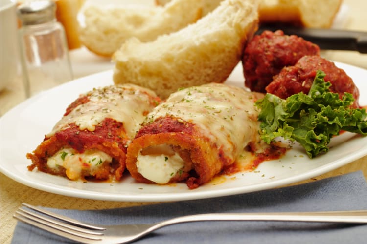 Eggplant rollatini served with bread and meatballs