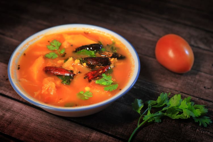 A bowl of sambar curry.